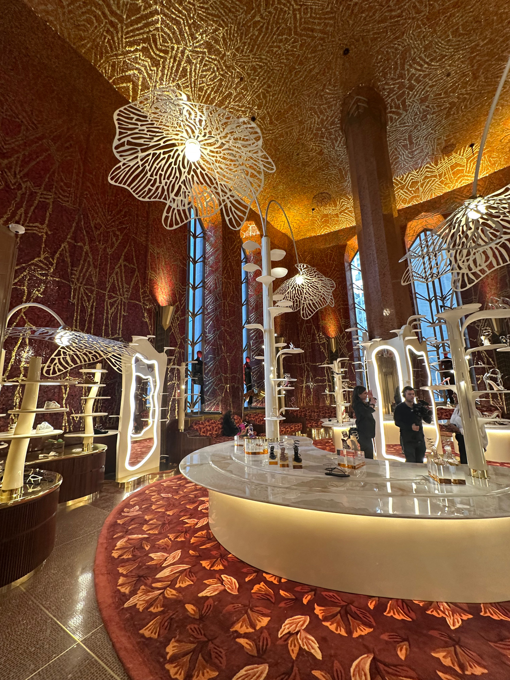 The landmarked Art Deco “Red Room” at One Wall Street, designed by Hildreth Meière in 1931—now home to Printemps’ designer shoe collection. Photo credit: International Hildreth Meière Associatio