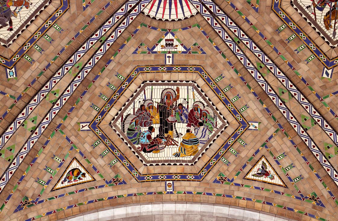 Hexagonal medallions with elaborate designs and borders set into ceiling of Nebraska Senate Chamber