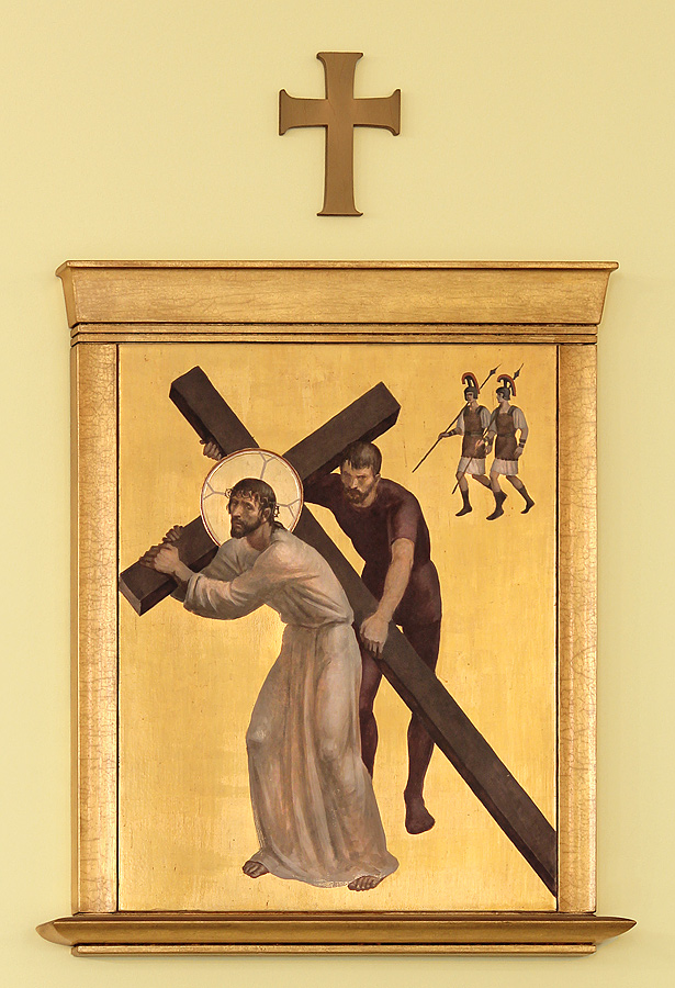 Simon helps Jesus carry the cross
